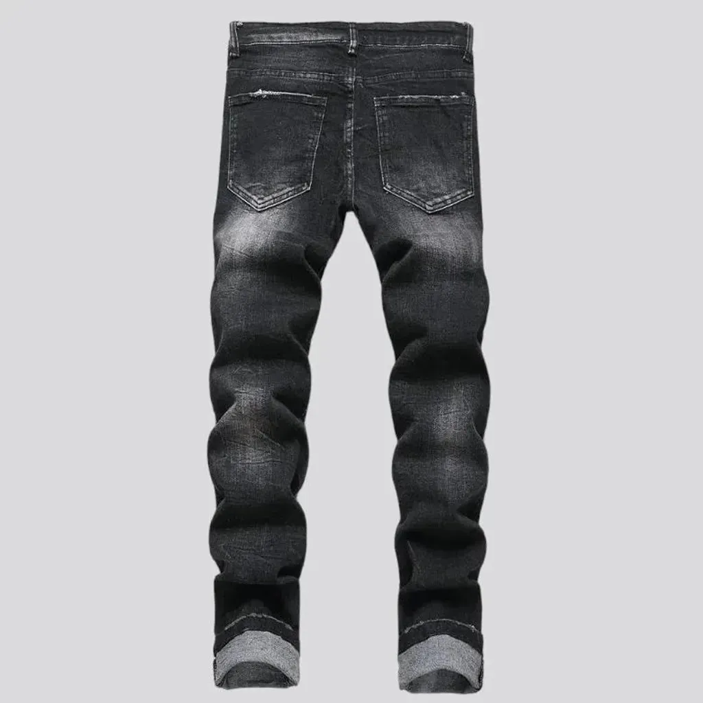 Damaged men's mid-waisted jeans