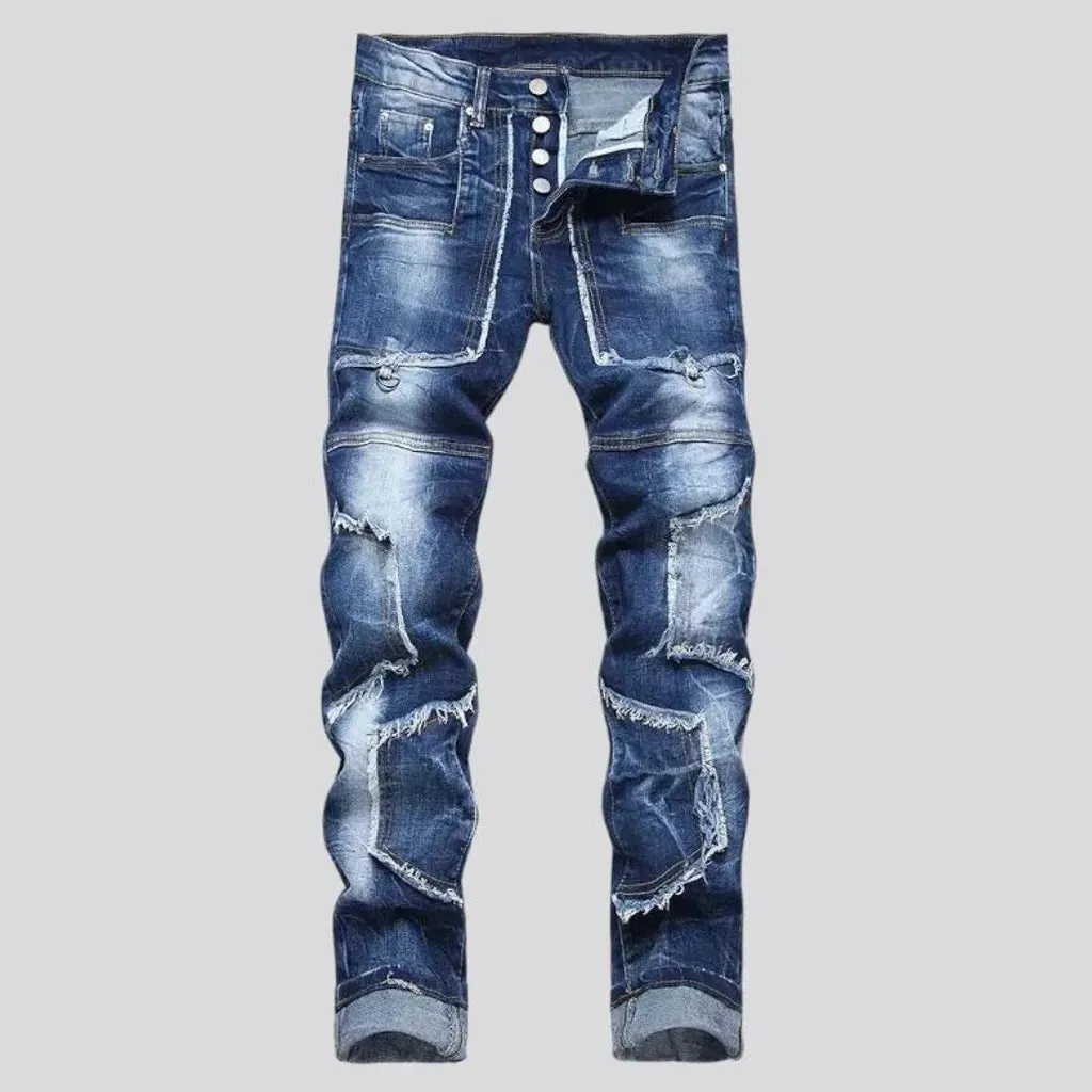 Damaged men's mid-waisted jeans