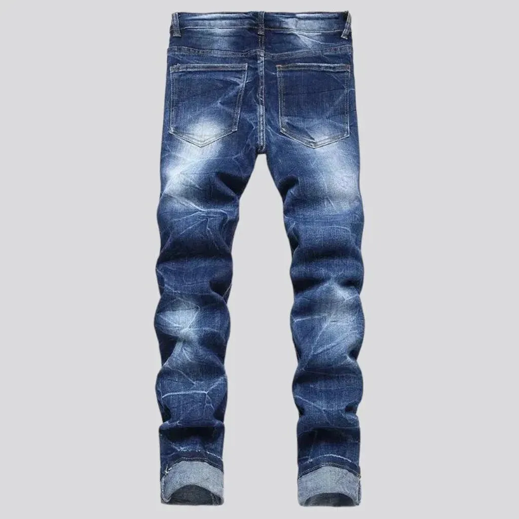 Damaged men's mid-waisted jeans